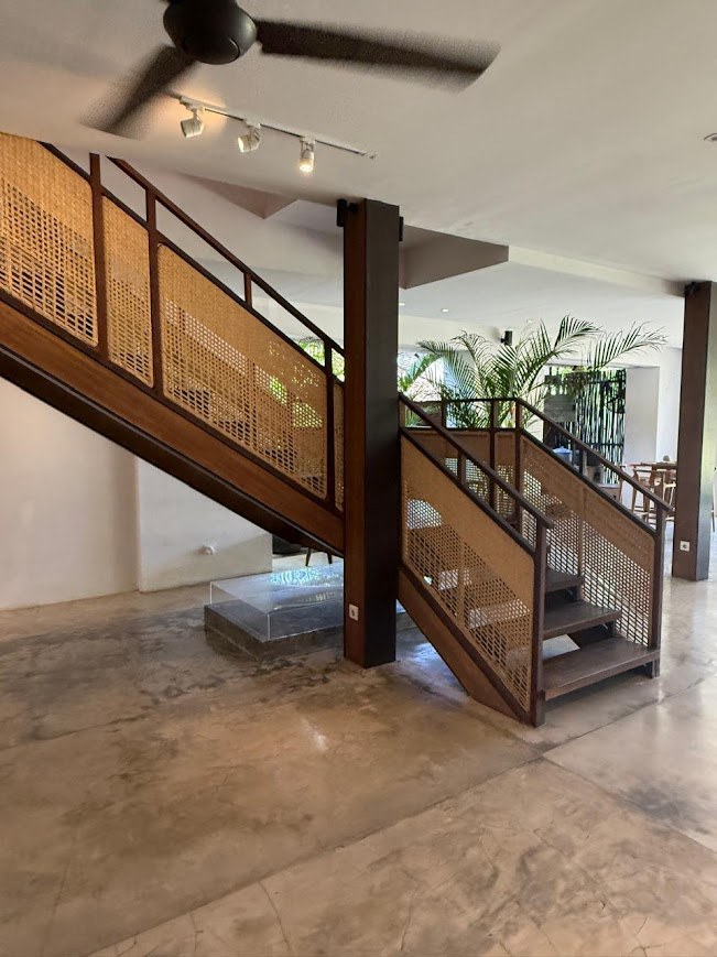 Teak staircase with rattan infill panels
